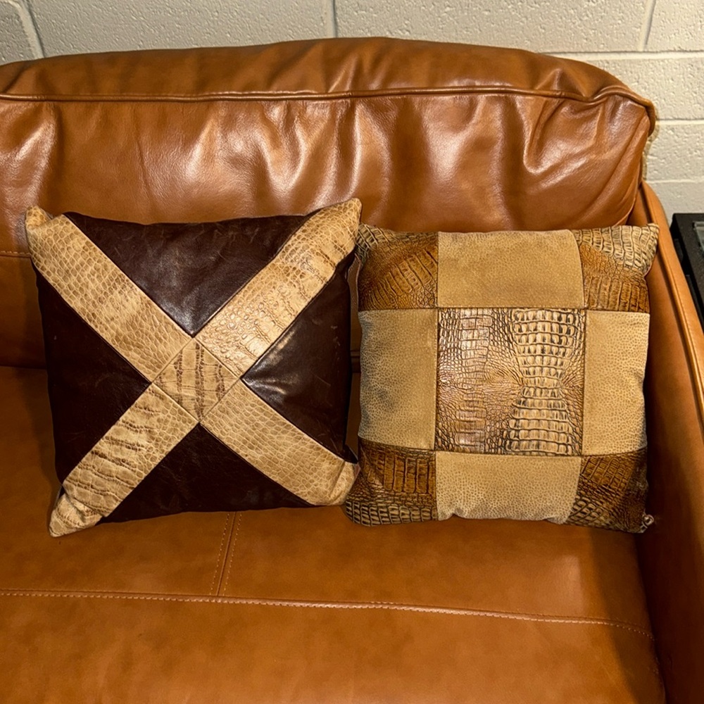 Two vintage leather and suede accent pillow in very good condition 12” x 12”